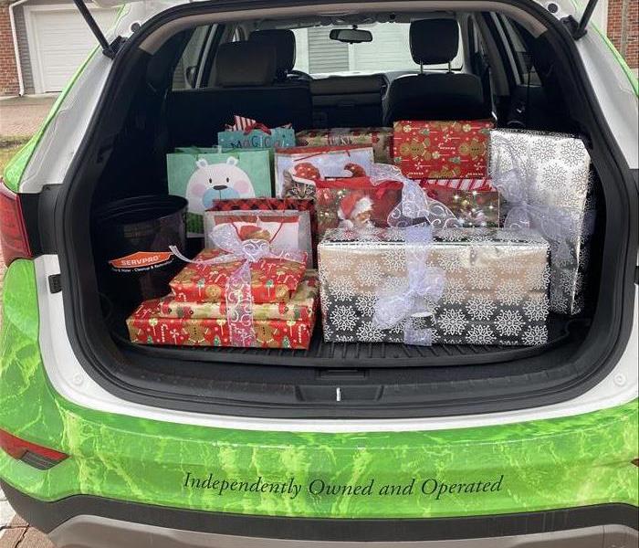 servpro car trunk filled with presents