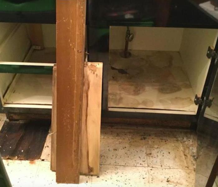 water damaged cabinet